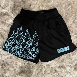 Kill Crew Muay Thai Flame Shorts in the black and teal colorway